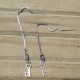 PENDIENTES LARGOS CON EMBLEMA BDSM TRISKEL EN ACERO 7496